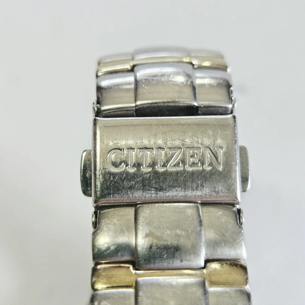 Citizen Eco-Drive Mens Date Watch Two Tone Stainless Champagne E111